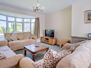 a living room with two couches and a tv at 4 Bed in Shanklin oc-ic068 in Shanklin