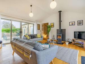 a living room with a couch and a tv at 3 Bed in Nr Masham oc-g0149 in Healey