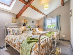 a bedroom with two beds and a window at 3 Bed in Nr Masham oc-g0149 in Healey