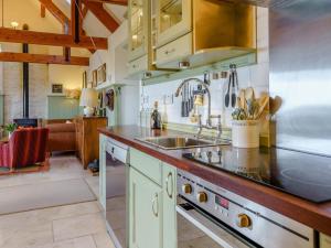 a kitchen with a sink and a stove at 2 Bed in Berwick -upon- Tweed oc-36344 in Kyloe +9 photos