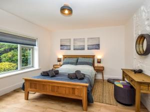 a bedroom with a bed and a window at 2 Bed in Lymington oc-87885 in Sway