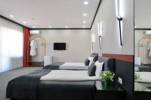 Кровать или кровати в номере Suncor Hotel +35 фотографий