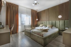 Un pat sau paturi într-o cameră la Residence Riverside +88 fotografii