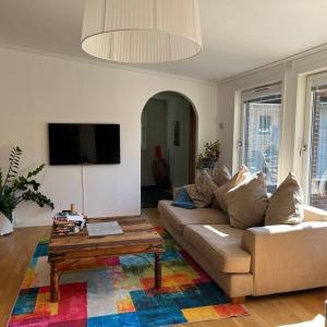 a living room with a couch and a coffee table at Workers Stay - Construction Worker Housing Sweden in Lund