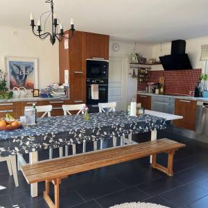 a kitchen with a table and a dining room at Workers Stay - Construction Worker Housing Sweden in Lund