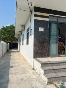 a building with a door on the side of it at Thiên Nam Motel in Dien Ban