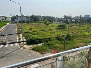 a view of a road with a field of grass at Thiên Nam Motel in Dien Ban +1 photo