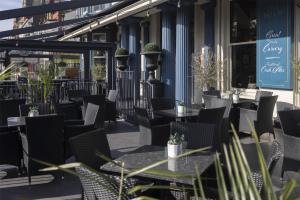 a patio of a restaurant with tables and chairs at The Bold Hotel; BW Signature Collection in Southport