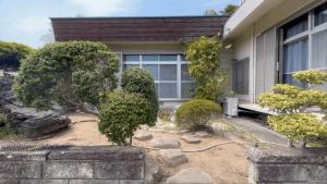 a house with a garden in front of it at Sane Yanagisawa in Awaji +19 photos