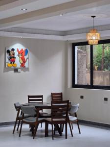 a dining room with a table and chairs at Oloisiri Namanga Hotel in Namanga