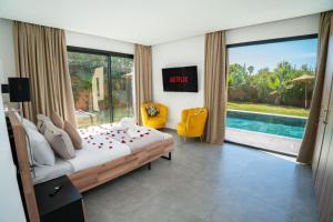 a bedroom with a bed with roses on it at Villa LaLa in Marrakesh