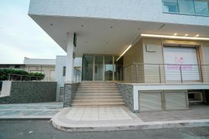 a building with a staircase in front of it at Xenia in Crotone