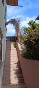 a walkway leading up to a building with a fence at Ferienwohnung Klaus in Warngau