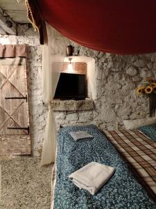 a bedroom with a bed and a tv in a room at Görbe Vendégház in Tarcal +44 photos