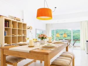 a dining room with a table with candles and flowers at Luxury Duplex - 2 Terraces - Private Beach in Tossa de Mar