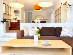 a living room with a couch and a coffee table at Luxury Duplex - 2 Terraces - Private Beach in Tossa de Mar +30 photos