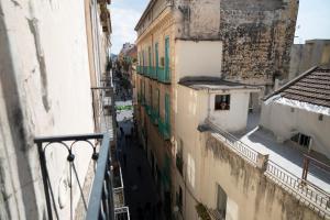 a view of an alley from a building at Open Space Suite in the Center of Salerno, modern apartment into Historic District, 250 meters from seafront and 20 meters from the Main Street Corso Garibaldi in Salerno