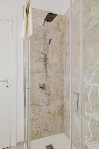a shower with a glass door in a bathroom at La casa di Gaia in Como +32 photos