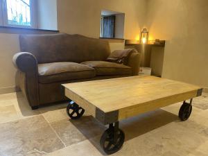 a living room with a couch and a coffee table at Haut Charmes de Cornil in Cornil +18 photos