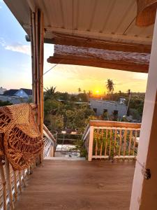 a sunset from the balcony of a house at PBrooms in Mui Ne