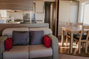 a living room with a couch and a table at Lower Cliff 19 in Easton