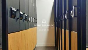 a row of wooden lockers in a gym at Hotel Princesa Parc in Arinsal +55 photos