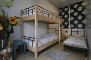 a bunk bed room with two beds and a table at K-Smart in Catania