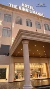 a hotel with a column in front of a building at Hotel Moti Mahal in Ambikāpur