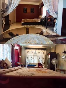 a bedroom with a large bed and a living room at Duke's RestHome in Kalimpong