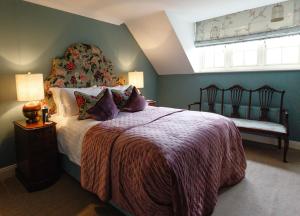 a bedroom with a large bed and a window at College Hill House in Slane