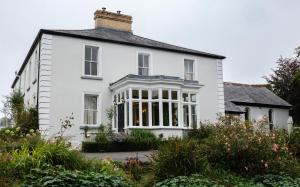 a white house with a lot of windows at College Hill House in Slane