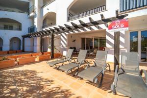 a group of chairs on a patio with a sold sign at Nice Groundfloor Apartment - BO202LT in Torre-Pacheco