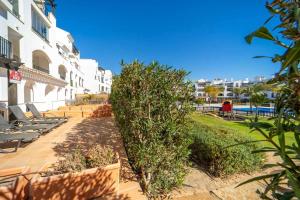 a view of a resort with chairs and a pool at Nice Groundfloor Apartment - BO202LT in Torre-Pacheco