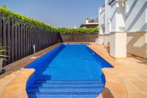 a swimming pool in a backyard with a fence at Villa with Private Pool - LO4LT in Torre-Pacheco