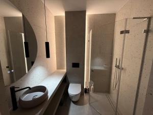 a bathroom with a sink and a toilet and a shower at Apartament 59 Bystra Park in Bystra +26 photos