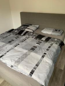 a bed with two pillows on top of it at Appartement in Bad Kreuznach