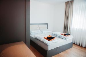 a bedroom with a bed with two towels on it at Haus Edelweiss in Tarrenz +39 photos