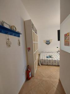 a room with a door to a bedroom with a bed at Amicizia Erminia in Pineto