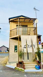 a building with a sign on the side of it at 街角TheStreetCorner in Noritake-Shinmachi