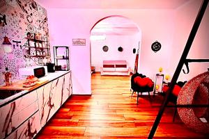 a room with a table and a chair in a room at La Macchia sui Sassi in Matera +25 photos