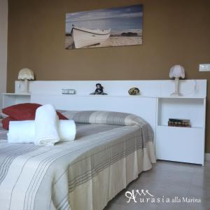 เตียงในห้องที่ Aurasia Alla Marina