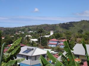 a group of houses with a mountain in the background at villa les Grenadines in Entre-Deux +14 photos