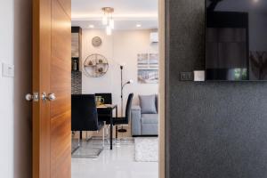 a door leading to a living room and a dining room at Condo Vireo Pool View Rawai in Phuket +20 photos