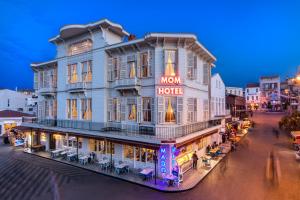 a large building with a mom hotel sign on it at Mom Hotel Buyukada in Adalar