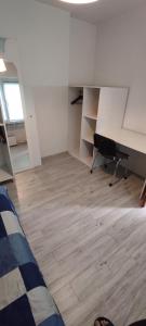 an empty room with a desk and a desk at Adam room 2 in Wrocław