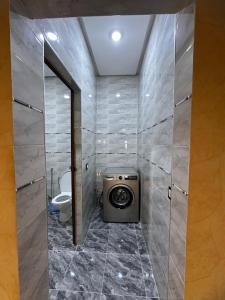a bathroom with a toilet and a sink at ZAHA Appart in Ksar es Sghir