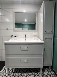 a bathroom with a sink and a mirror at Chambre d'hôtes l'Heure Bleue in Saint-Alvère +39 photos