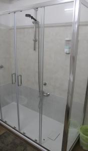 a shower with a glass door in a bathroom at La Vinella in Lamezia Terme