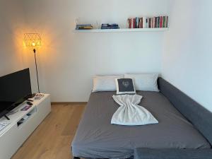 a bedroom with a bed with a pillow on it at Dream Home - Kapuziner Platz in Brunico