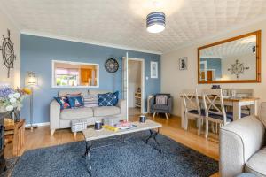 a living room with a couch and a table at 2 Bed in Reedham oc-c29528 in Haddiscoe +20 photos